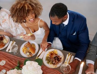 Bride and groom at a City Barbeque–catered reception